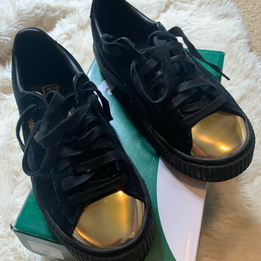 Black/gold puma